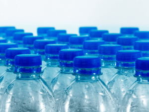 An image of several plastic water bottles